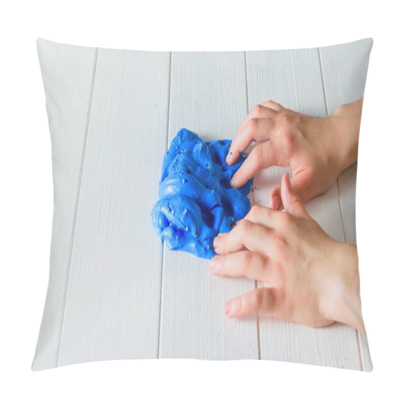 Personality  The Child Presses His Fingers On The Blue Slide On The Wooden Table. Pillow Covers