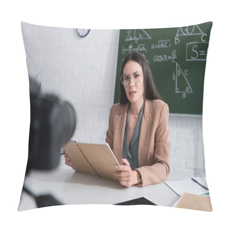 Personality  Teacher Holding Notebook Near Digital Tablet And Camera In Classroom  Pillow Covers