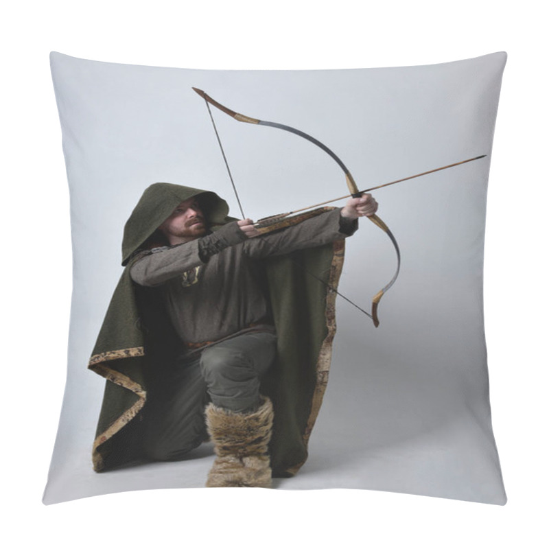 Personality  Full Length  Portrait Of  Young Handsome Man  Wearing  Medieval Celtic Adventurer Costume With Hooded Cloak, Holding  Archery Bow And Arrow, Isolated On Studio Background. Pillow Covers