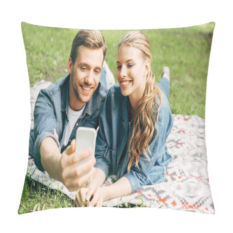 Personality  Smiling Young Couple Lying On Grass At Park And Taking Selfie Pillow Covers