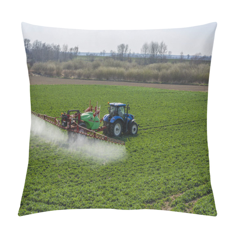 Personality  Nieciecza, Poland - March 28, 2020: Agriculture. Blue New Holland T6 Tractor With Green And Red Sprayer Krukowiak Goliat During Spraying Spring Rapeseed. Pillow Covers