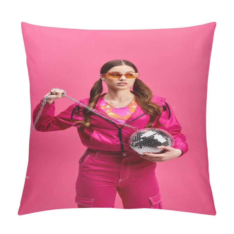 Personality  A Vibrant Woman In Her 20s, Donning A Stylish Pink Outfit, Holds A Disco Ball, Exuding Energy Against A Pink Backdrop. Pillow Covers