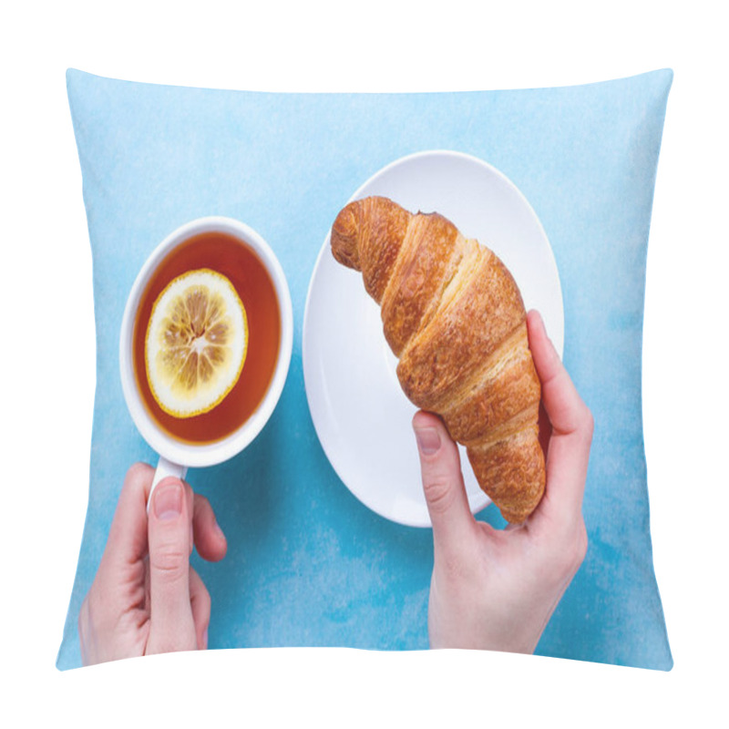 Personality  Freshly Baked Croissants And A Cup Of Hot Tea With Lemon In Hand For French Breakfast On A Blue Background. Top View  Pillow Covers