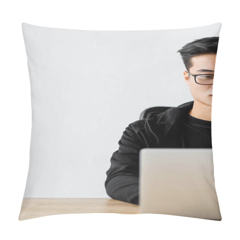 Personality  Cropped View Of Asian Hacker In Glasses Sitting At Table And Using Laptop  Pillow Covers