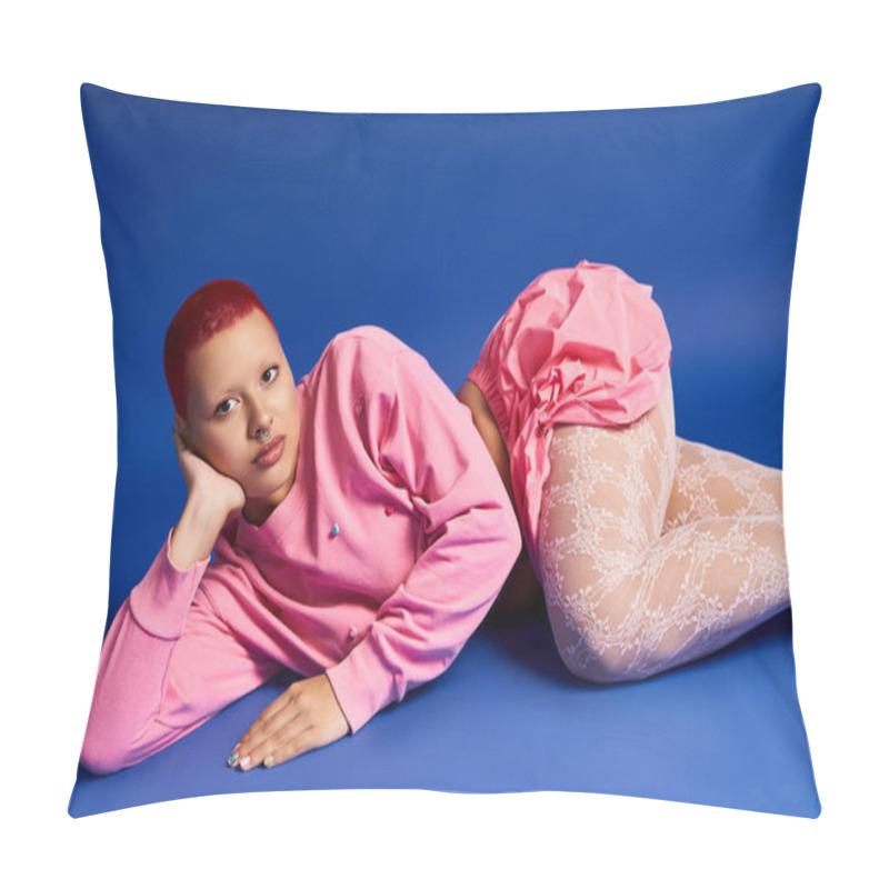 Personality  A Bold Young Woman With Pink Hair Showcases Her Unique Style Against A Vibrant Blue Backdrop, Exuding Confidence. Pillow Covers