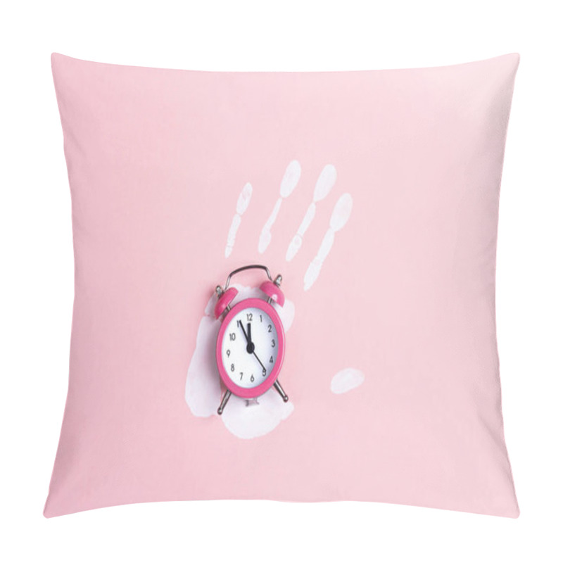 Personality  Pink alarm clock with white palm print on pink background. Top view, flat lay. pillow covers