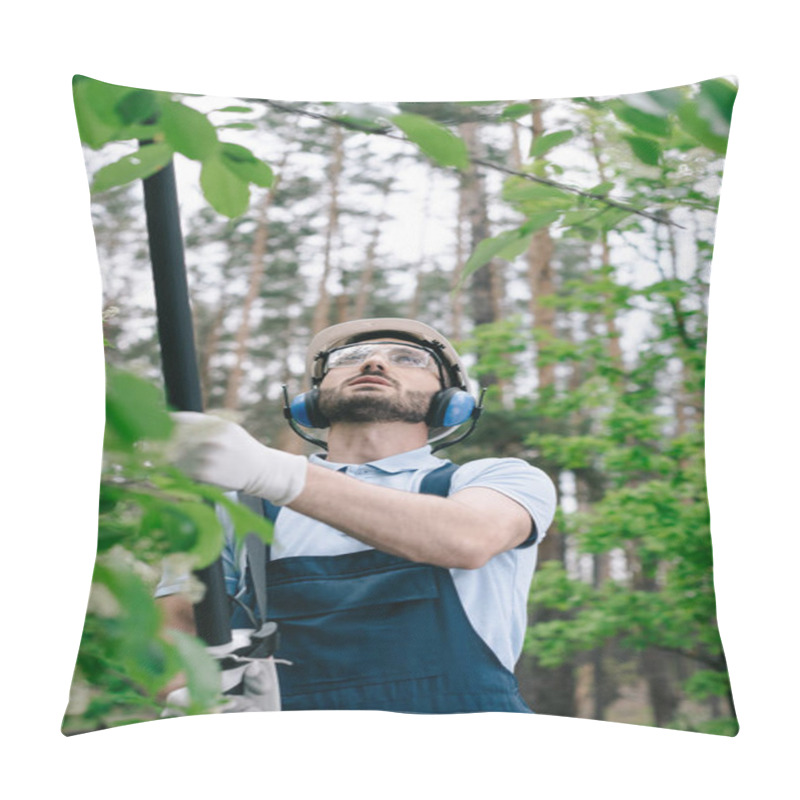 Personality  Selective Focus Of Gardener In Helmet, Protective Glasses And Hearing Protectors Trimming Trees With Telescopic Pole Saw In Garden Pillow Covers