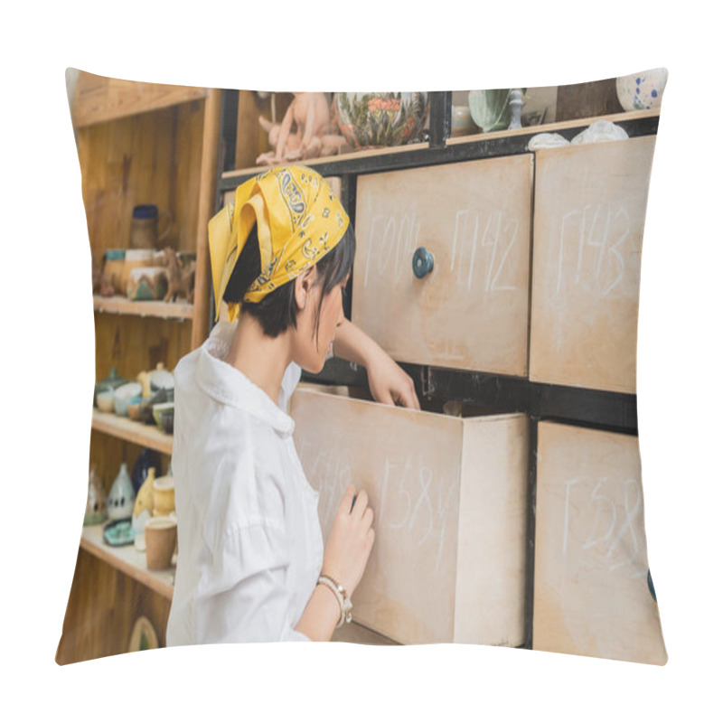 Personality  Side View Of Young Asian Female Artist In Headscarf And Workwear Opening Cupboard While Working In Blurred Pottery Workshop, Pottery Workshop With Skilled Artisan Pillow Covers