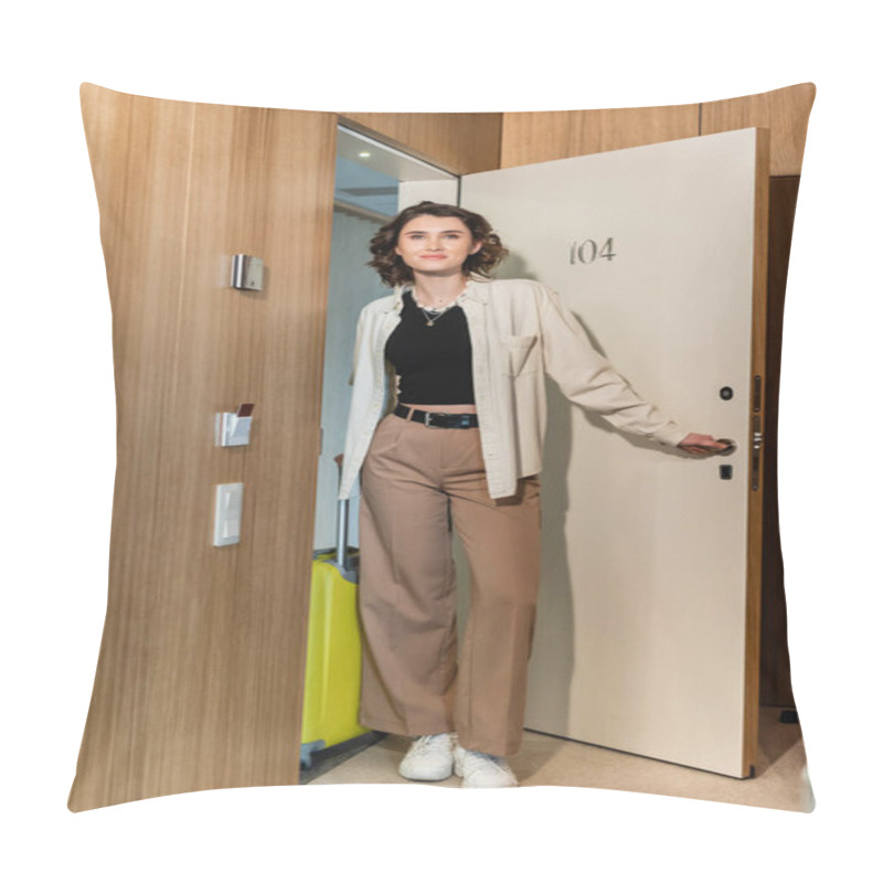 Personality  Full Length Of Pleased Woman In White Shirt And Beige Pants, With Wavy Brunette Hair Holding Yellow Travel Bag And Smiling While Opening Door Of Hotel Suite Near Keycard Reader, Check-in  Pillow Covers