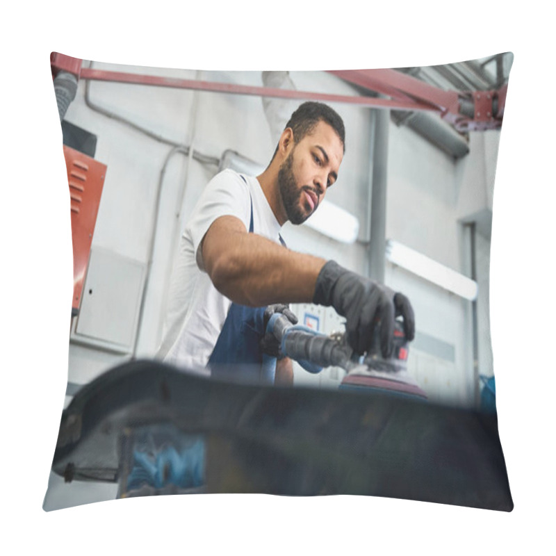 Personality  Handsome Mechanic Uses A Power Tool To Perfect A Vehicle Part In A Busy Garage Setting. Pillow Covers