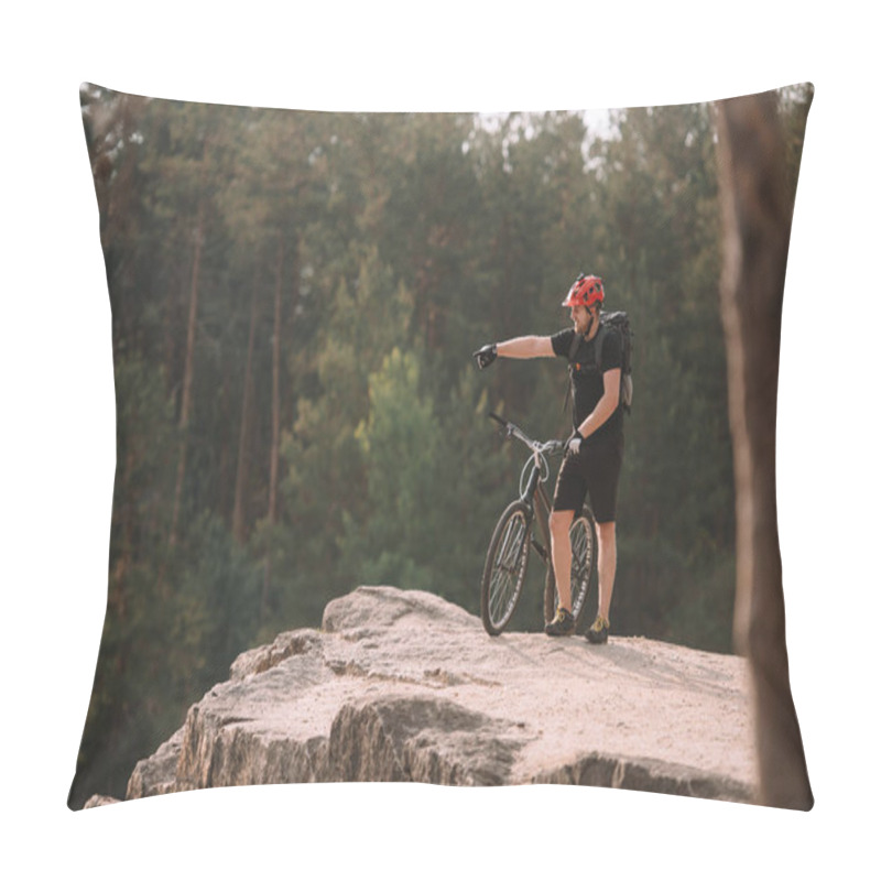 Personality  Young Trial Biker Standing On Rocky Cliff Outdoors And Pointing Somewhere Pillow Covers