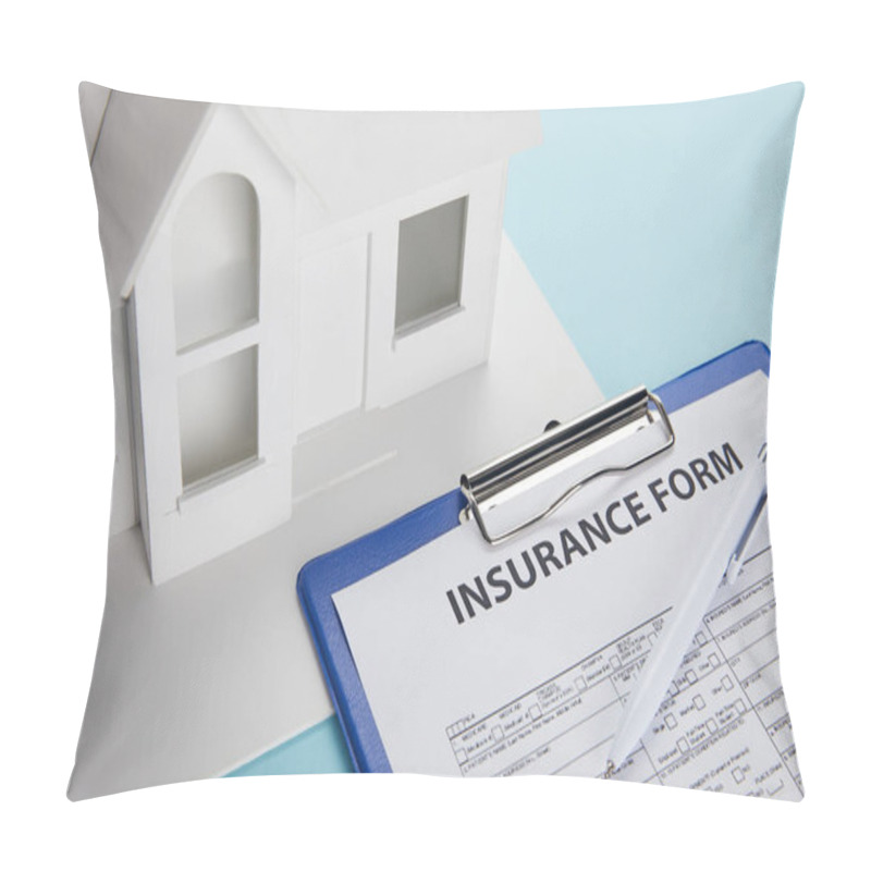 Personality  Close-up View Of Insurance Form And Small House Model With Clipboard And Pen On Blue  Pillow Covers