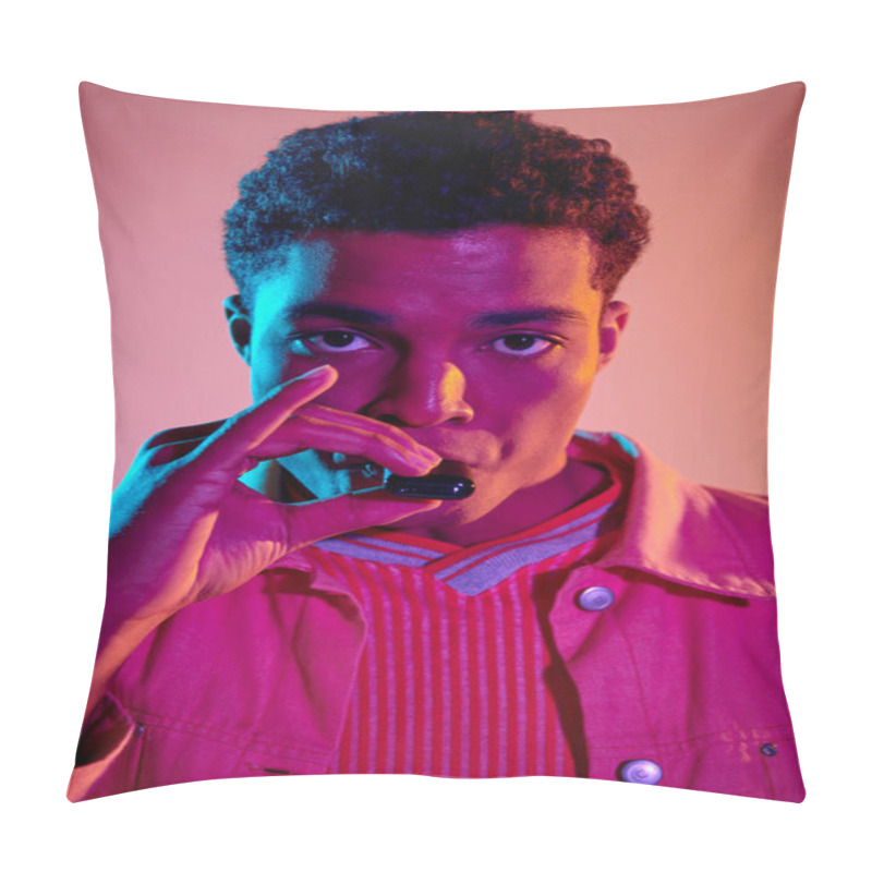 Personality  Portrait Of African American Guy Holding E Cigarette Near Mouth On Colorful Background With Light Pillow Covers