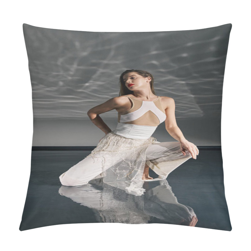 Personality  A Young Woman In A White Outfit Poses On A Reflective Grey Floor, Her Reflection Mirroring Her Pose. Pillow Covers