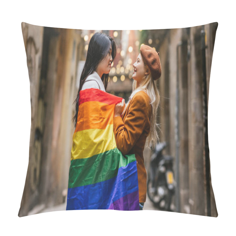 Personality  Two Young Women, Possibly Students Or Activists, Are Holding A Rainbow Flag Between Them And Smiling At Each Other In A City Street Pillow Covers