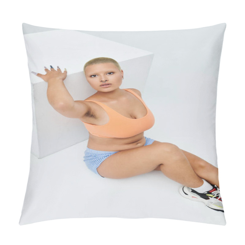 Personality  A Young Bald Woman In Vibrant Attire Strikes A Bold Pose Beside A Geometric White Structure. Pillow Covers