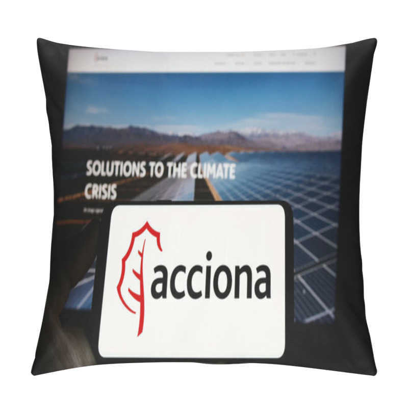 Personality  Stuttgart, Germany - 04-16-2023: Person Holding Mobile Phone With Logo Of Spanish Infrastructure Company Acciona SA On Screen In Front Of Web Page. Focus On Phone Display. Pillow Covers