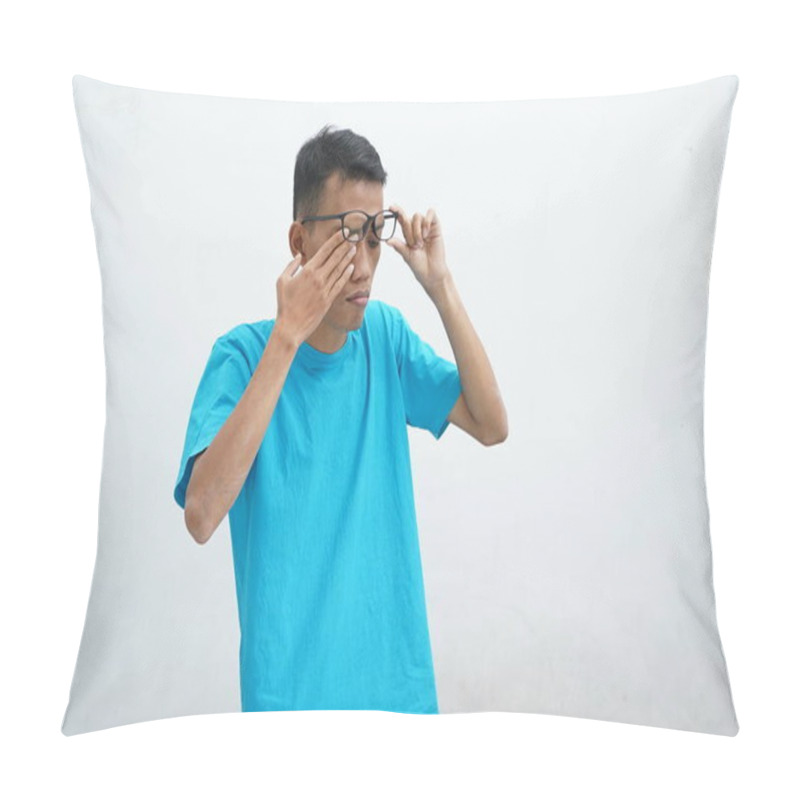 Personality  Young Asian Wearing Unhealthy Blue T-shirt With Glasses, Rubbing Eyes, Suffering From Blurred Vision, Dry Eye Syndrome, Dizziness, Isolated On White Background. Health Problem Concept Pillow Covers