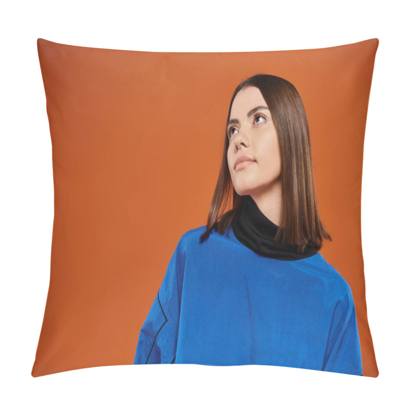 Personality  Pensive Woman With Pierced Nose Looking Away While Standing In Blue Jacket On Orange Background Pillow Covers