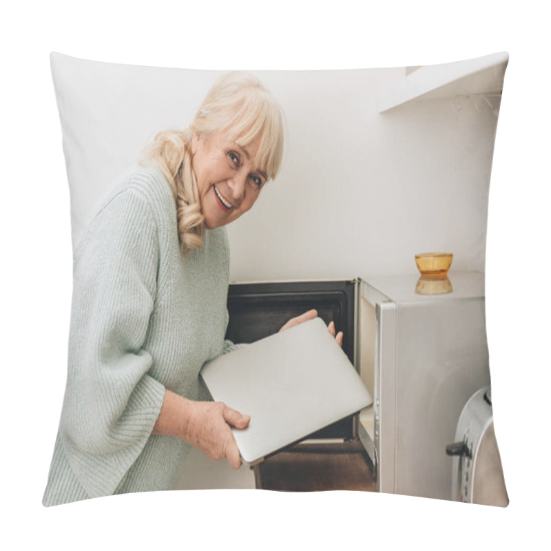 Personality  Cheerful Senior Woman With Dementia Disease Putting Laptop In Microwave Oven Pillow Covers