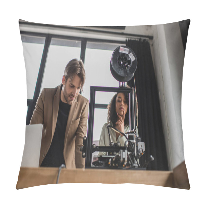 Personality  Low Angle View Of Young Interracial Designers Working With 3D Printer In Modern Office Pillow Covers