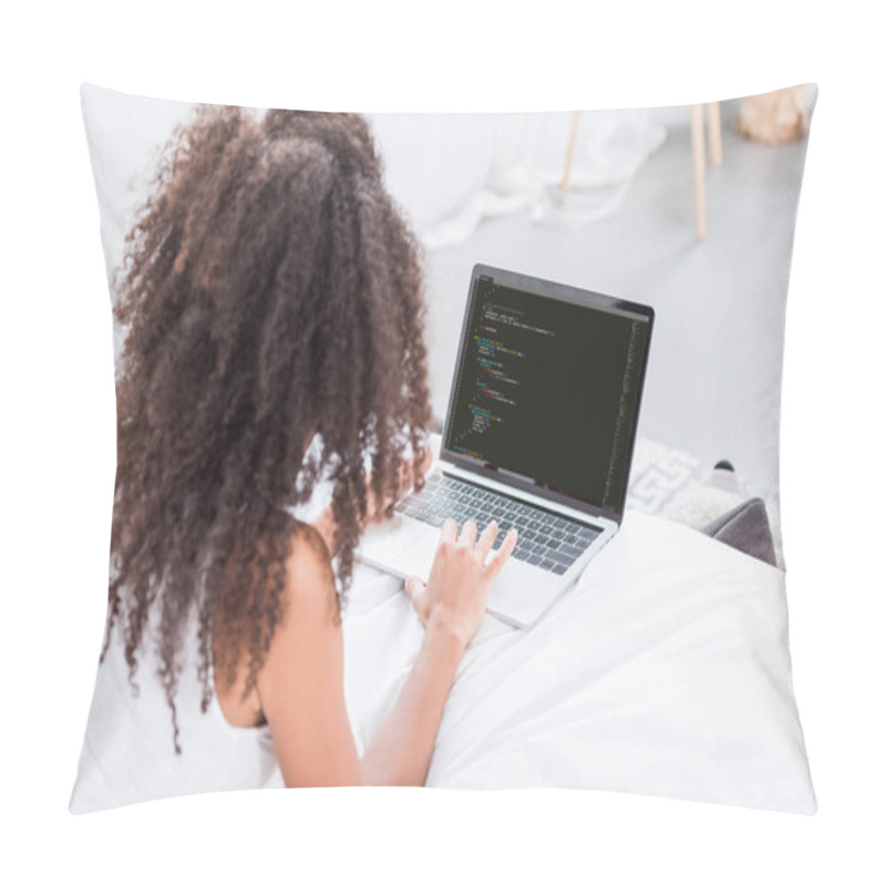 Personality  Rear View Of Curly Woman Using Laptop With Programming Code On Screen In Bed At Home Pillow Covers