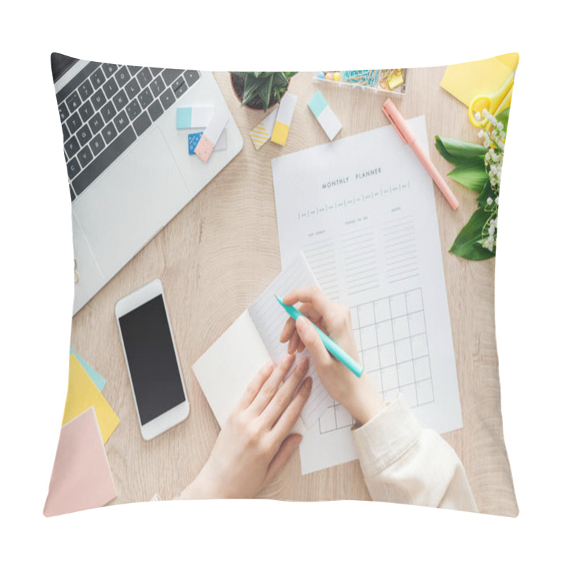 Personality  Cropped View Of Woman Sitting Behind Wooden Table With Smartphone, Laptop And Stationery, Writing In Monthly Planner Pillow Covers