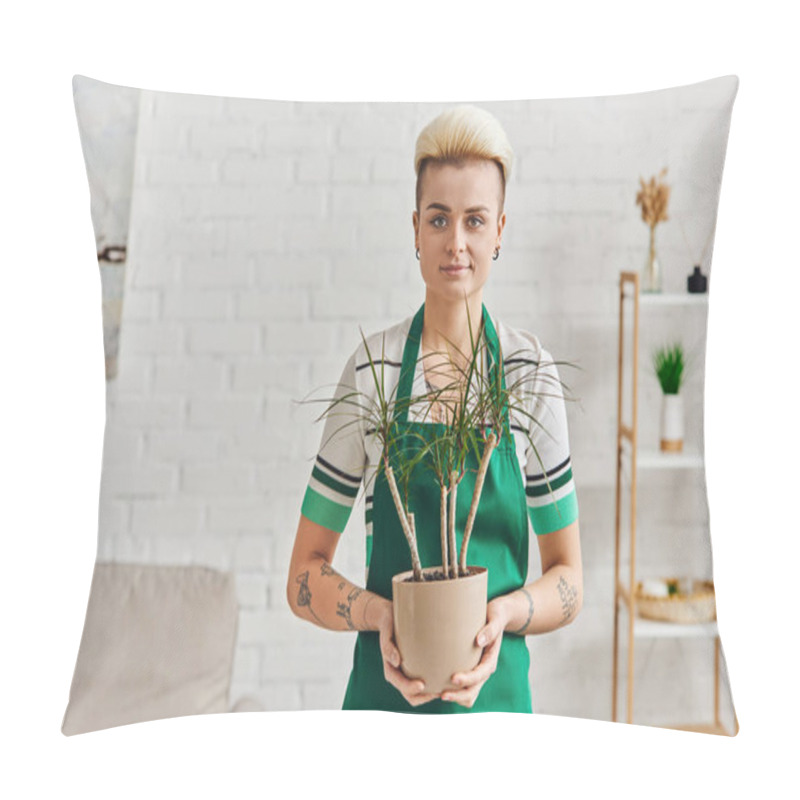 Personality  Tattooed Woman With Trendy Hairstyle, Wearing Green Apron, Holding Flowerpot With Tropical Plant And Looking At Camera In Apartment, Eco-friendly, Sustainable Home Decor And Green Living Concept Pillow Covers