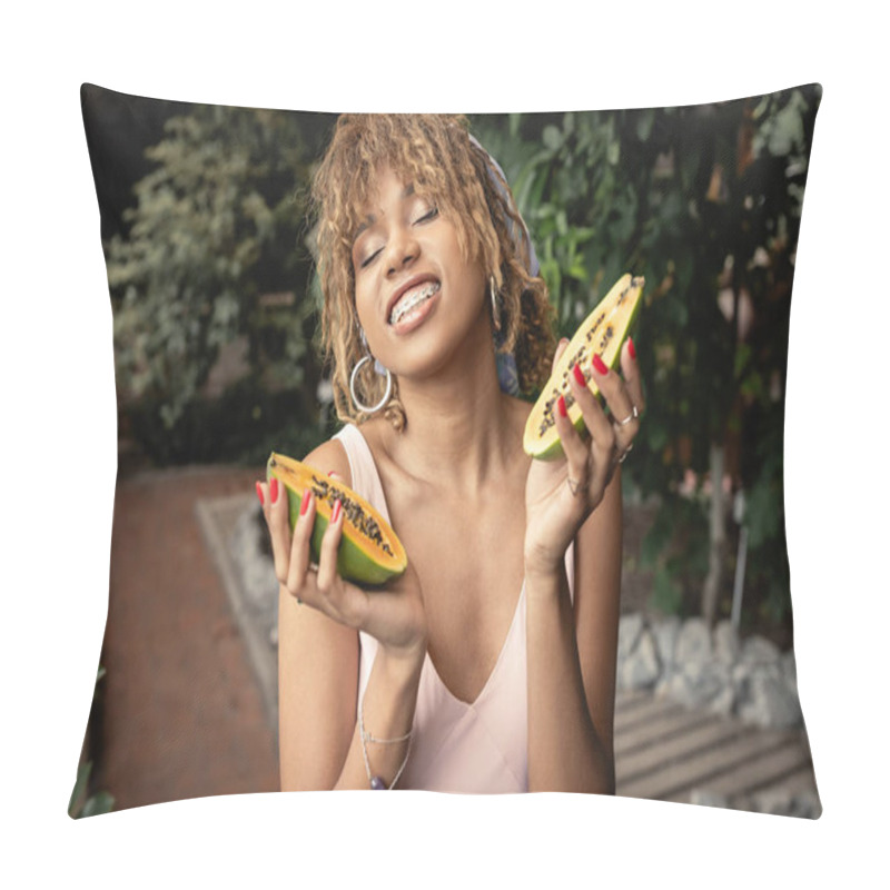 Personality  Smiling Young African American Woman With Braces Waring Summer Outfit And Closing Eyes While Holding Fresh Papaya In Blurred Indoor Garden, Fashion-forward Lady Inspired By Tropical Plants Pillow Covers