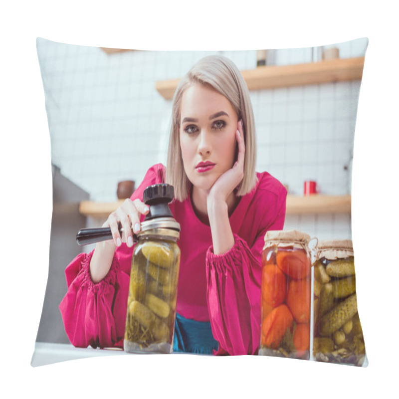 Personality  Beautiful Fashionable Housewife Looking At Camera And Holding Seamer With Jars Of Pickled Vegetables On Kitchen Counter  Pillow Covers