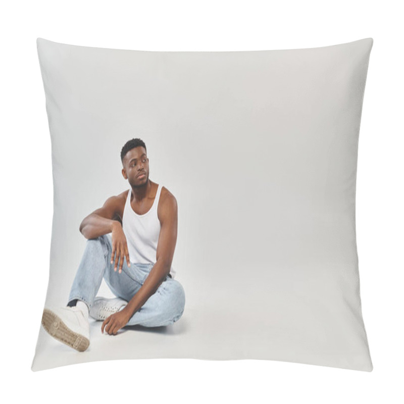 Personality  Young African American Man Seated, Legs Crossed, In Studio Setting Against A Grey Background. Pillow Covers