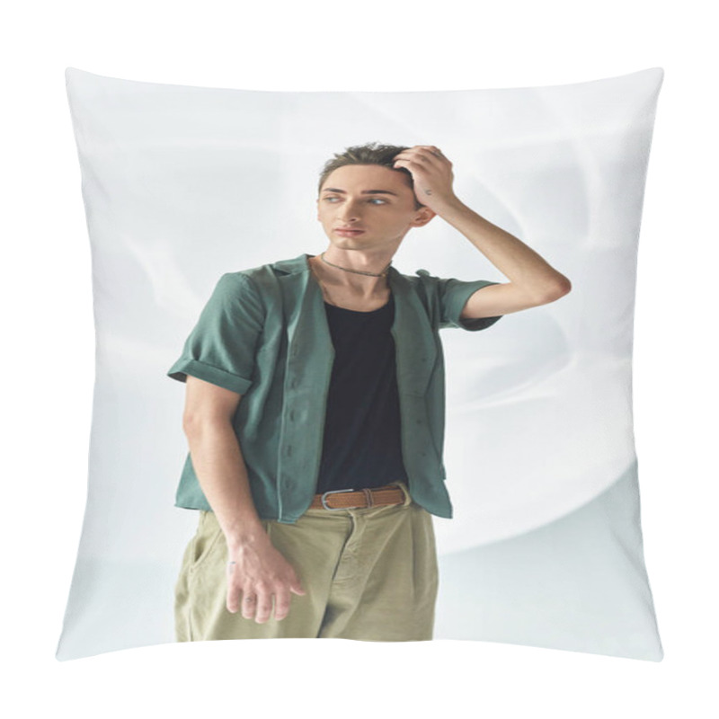 Personality  A Young Queer Person With Pride Wear A Green Shirt And Khaki Pants, Posing Confidently In A Studio Set Against A Grey Background. Pillow Covers