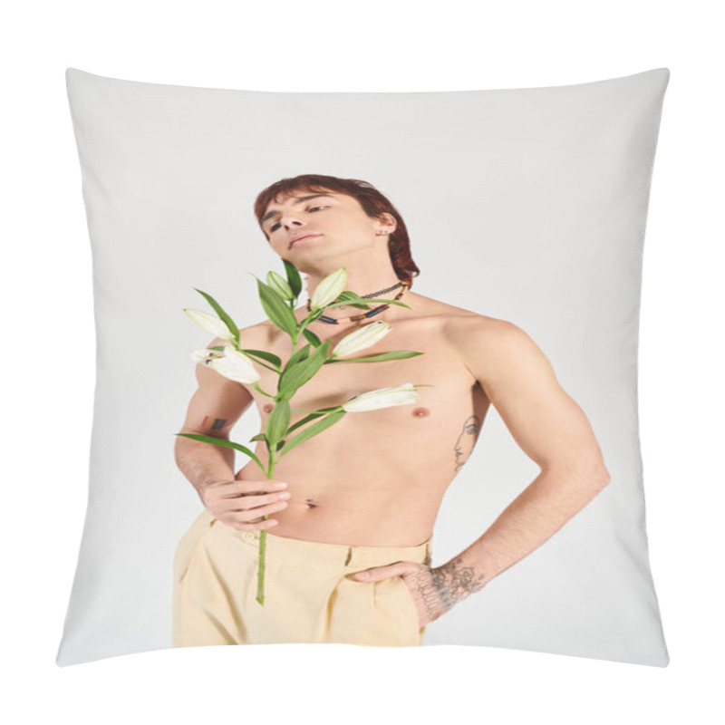 Personality  A Young Man Confidently Holding A Delicate Flower In A Studio With A Grey Backdrop, Exuding A Sense Of Intimacy And Beauty. Pillow Covers