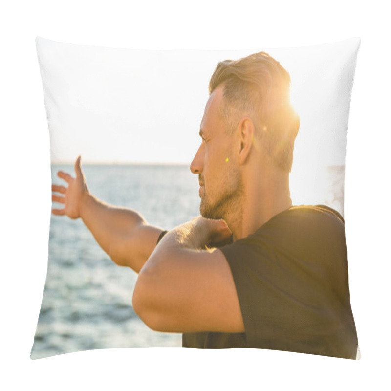 Personality  Handsome Adult Sportsman Stretching Arm Before Training On Seashore In Front Of Sunrise Pillow Covers