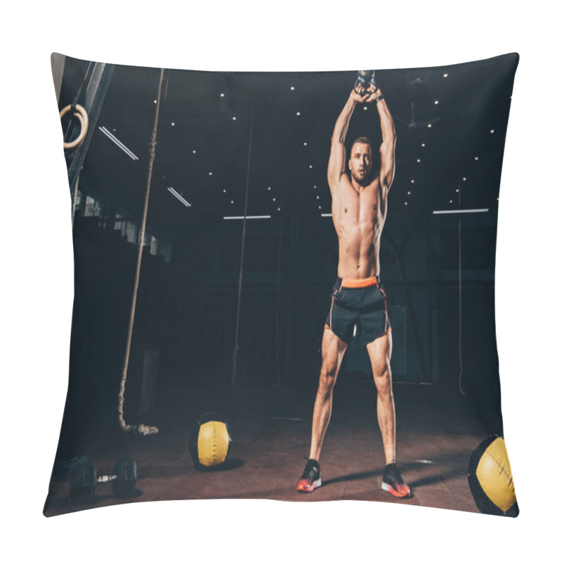 Personality  Handsome Athletic Man Holding Kettlebell Overhead While Working Out  In Dark Gym Pillow Covers