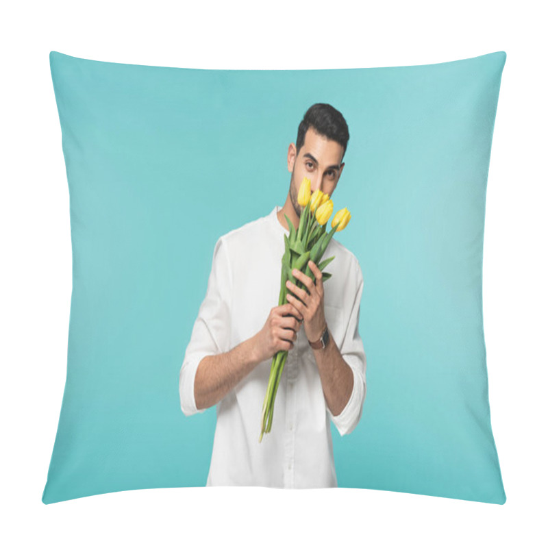 Personality  Young Arabian Man In White Shirt Holding Yellow Flowers Isolated On Blue  Pillow Covers