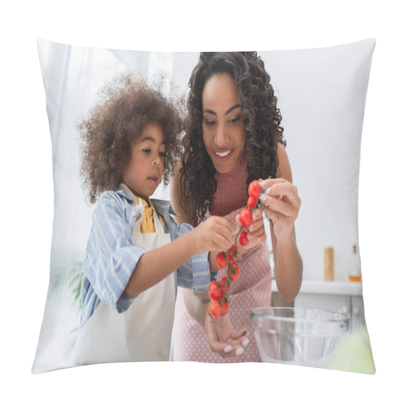 Personality  Positive African American Mother And Kid Holding Cherry Tomatoes Near Cutting Board In Kitchen  Pillow Covers