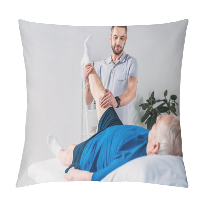 Personality  Portrait Of Rehabilitation Therapist Massaging Senior Mans Leg On Massage Table Pillow Covers