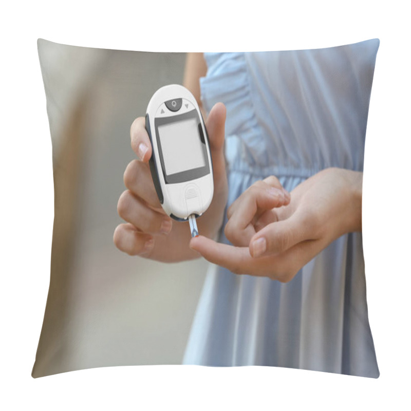 Personality  Woman Using Digital Glucometer On Blurred Background. Diabetes Control Pillow Covers