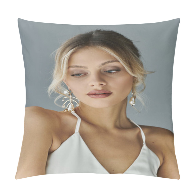 Personality  A Captivating Young Woman With Blonde Hair Dons A White Top And Earrings, Exuding Elegance And Beauty Against A Grey Backdrop. Pillow Covers