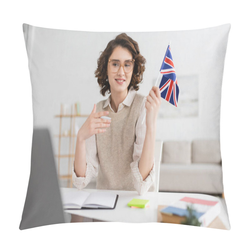 Personality  Young Language Teacher In Eyeglasses Holding Flag Of United Kingdom Near Laptop On Blurred Foreground At Home Pillow Covers