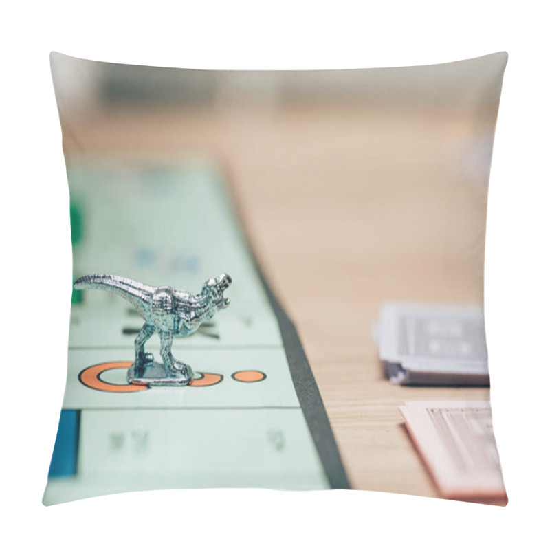 Personality  KYIV, UKRAINE - NOVEMBER 15, 2019: Selective Focus Of Playing Figure On Monopoly Game With Toy Currency On Table Pillow Covers