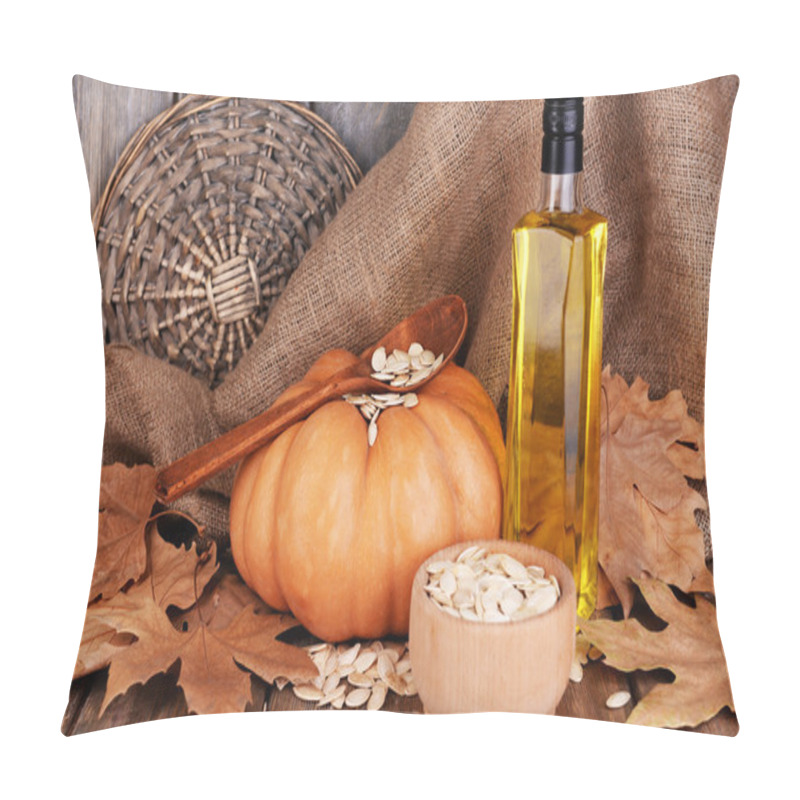 Personality  Pumpkin Seed Oil In Glass Bottle And Fresh Pumpkin On Wooden Background Pillow Covers