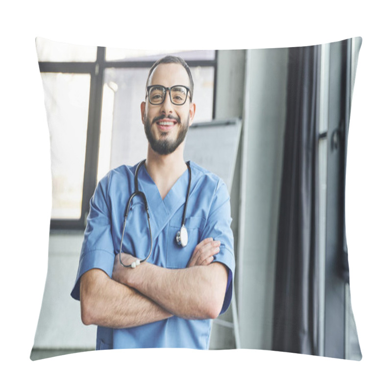 Personality  Cheerful And Bearded Doctor In Eyeglasses And Blue Uniform Standing With Folded Arms And Stethoscope While Looking At Camera, First Aid Training Seminar And Emergency Preparedness Concept Pillow Covers