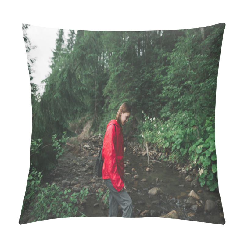 Personality  Beautiful Hiker Girl In A Red Raincoat Walks In The Forest In The Wild,crosses A Mountain Stream, Looks Down At The Water. Hiking Woman In The Mountains, Vacation In The Wild. Pillow Covers