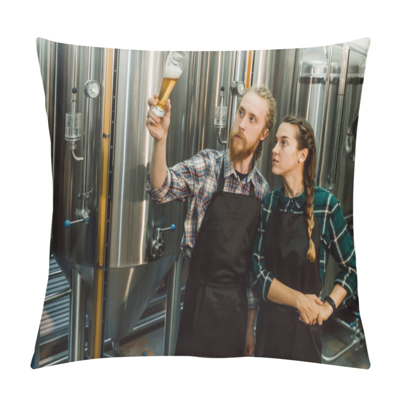 Personality  Brewery Workers Looking At Freshly Made Beer In Glass Tube And Discussing It. Male And Female Brewer Testing Beer At Brewery Factory. 4k. Small Business Concept. Pillow Covers