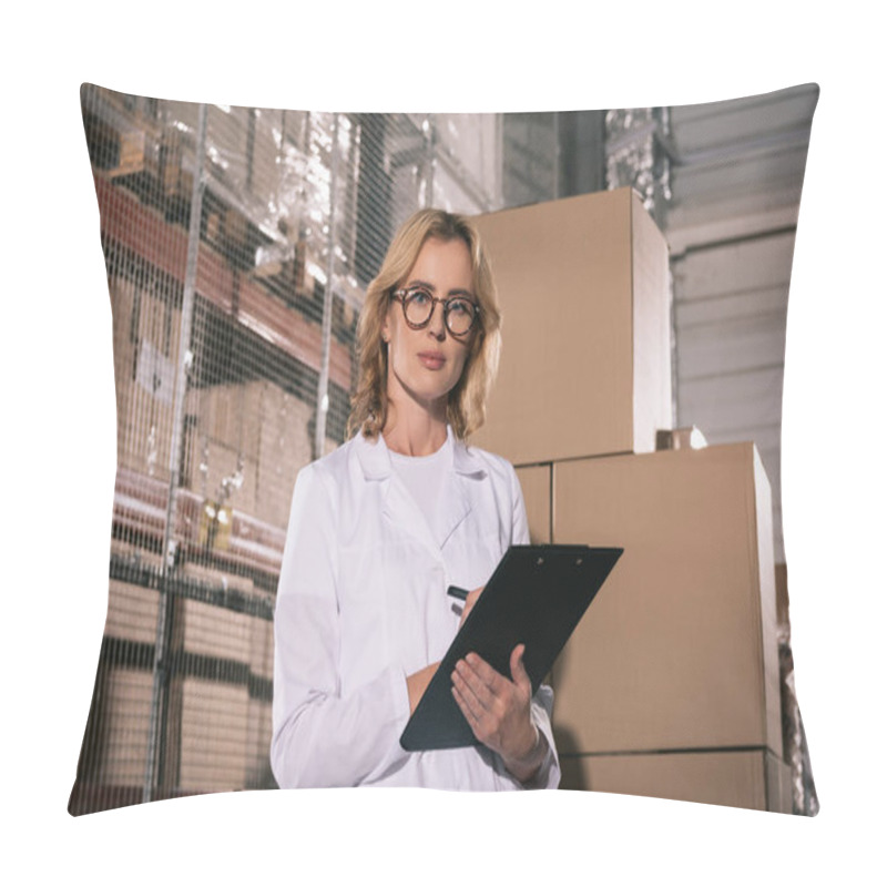 Personality  Serious Storekeeper Looking At Camera While Writing On Clipboard In Warehouse Pillow Covers