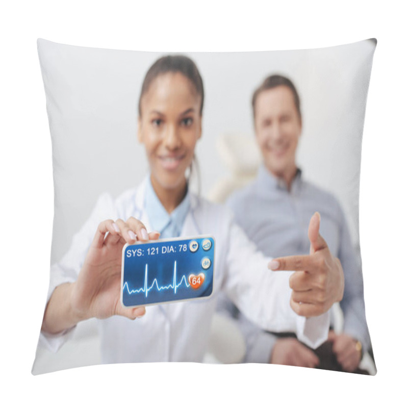 Personality  Selective Focus Of Cheerful African American Dentist Pointing With Finger At Smartphone With Heartbeat Rate Near Happy Patient  Pillow Covers