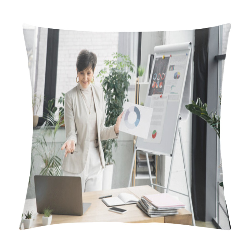 Personality  Satisfied Mature Businesswoman With Infographics Pointing At Laptop, Video Call In Modern Office Pillow Covers