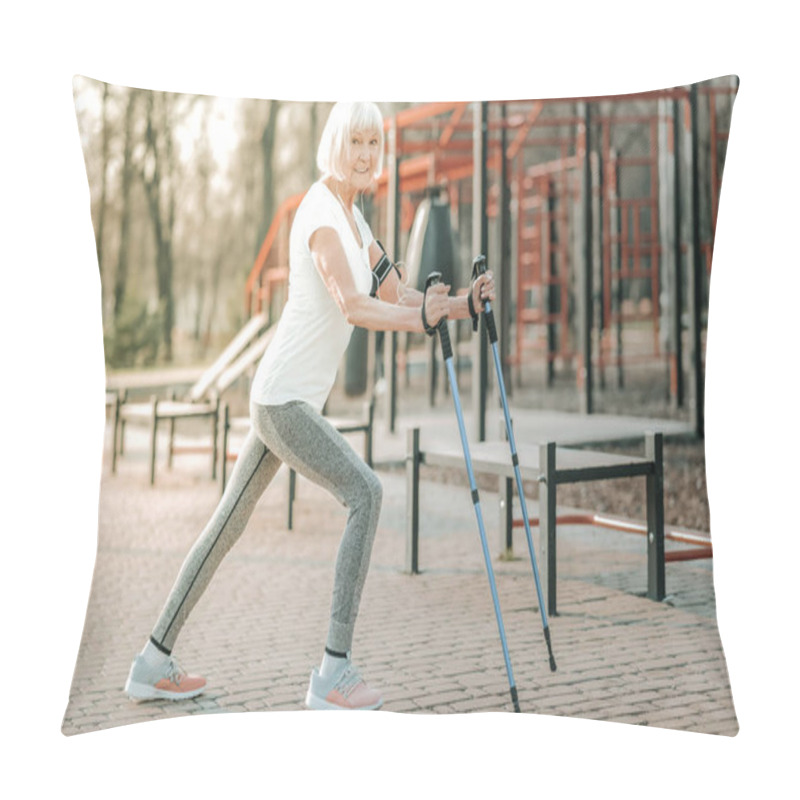 Personality  Long Steps With Walking Poles. Appealing Sporty Madam In Advanced Years Wearing Workout Clothing Doing Long Steps With Walking Poles On The Athletic Ground Pillow Covers